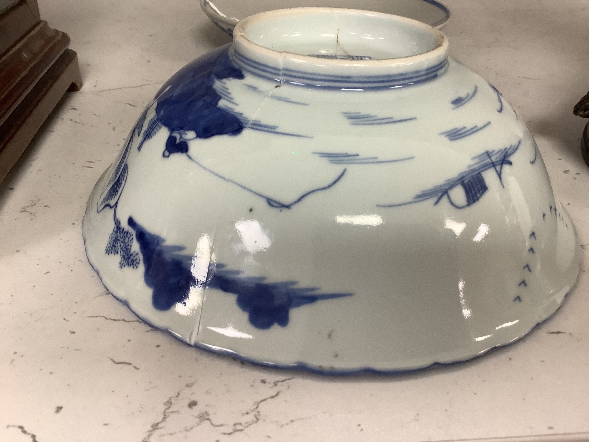 A Chinese blue and white landscape bowl, a/f and a Chinese blue and white ‘dragon’ dish, 18 and 16.5 cm